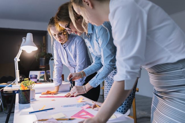 group-businesswomen-drawing-plan-white-paper-with-instruments-desk-workplace group-businesswomen-drawing-plan-white-paper-with-instruments-desk-workplace